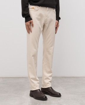 Versace Бежевые джинсы с логотипом патча 10190501A15041