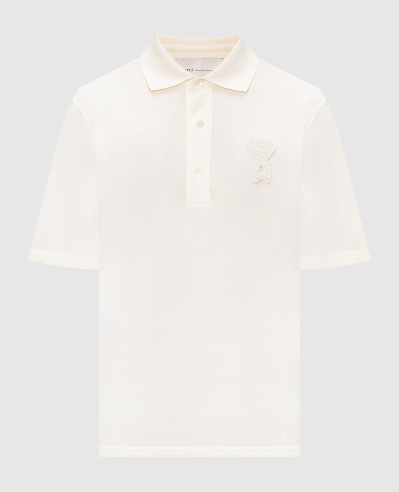 Бежевое поло с фактурной нашивкой эмблемы