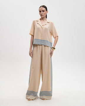 Ermanno Scervino Бежеві штани із шовку в принт D482P756YLT