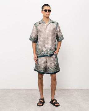 AMIRI Бежеві шорти із шовку в брендовий принт AMBMSO1036