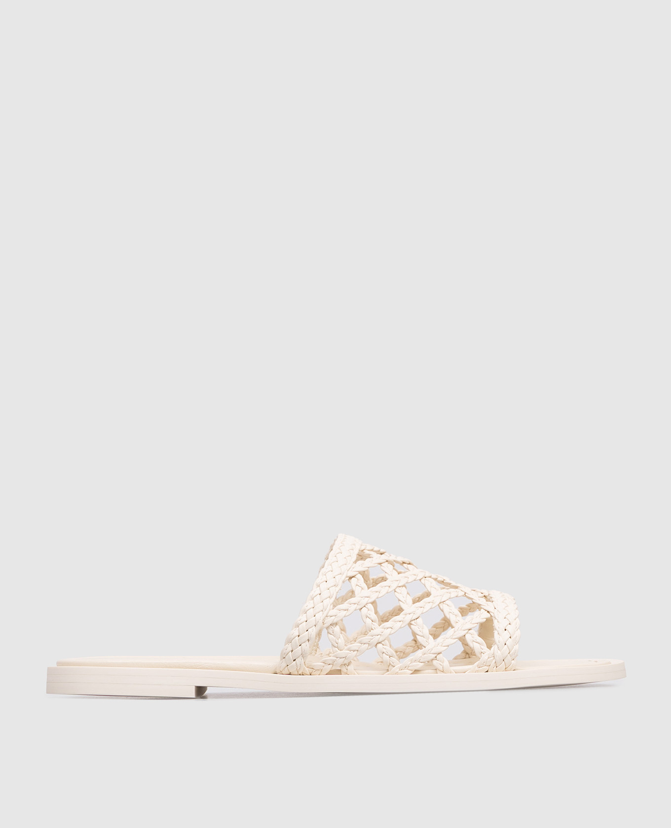 Кожаные шлепанцы цвета айвори с плетением